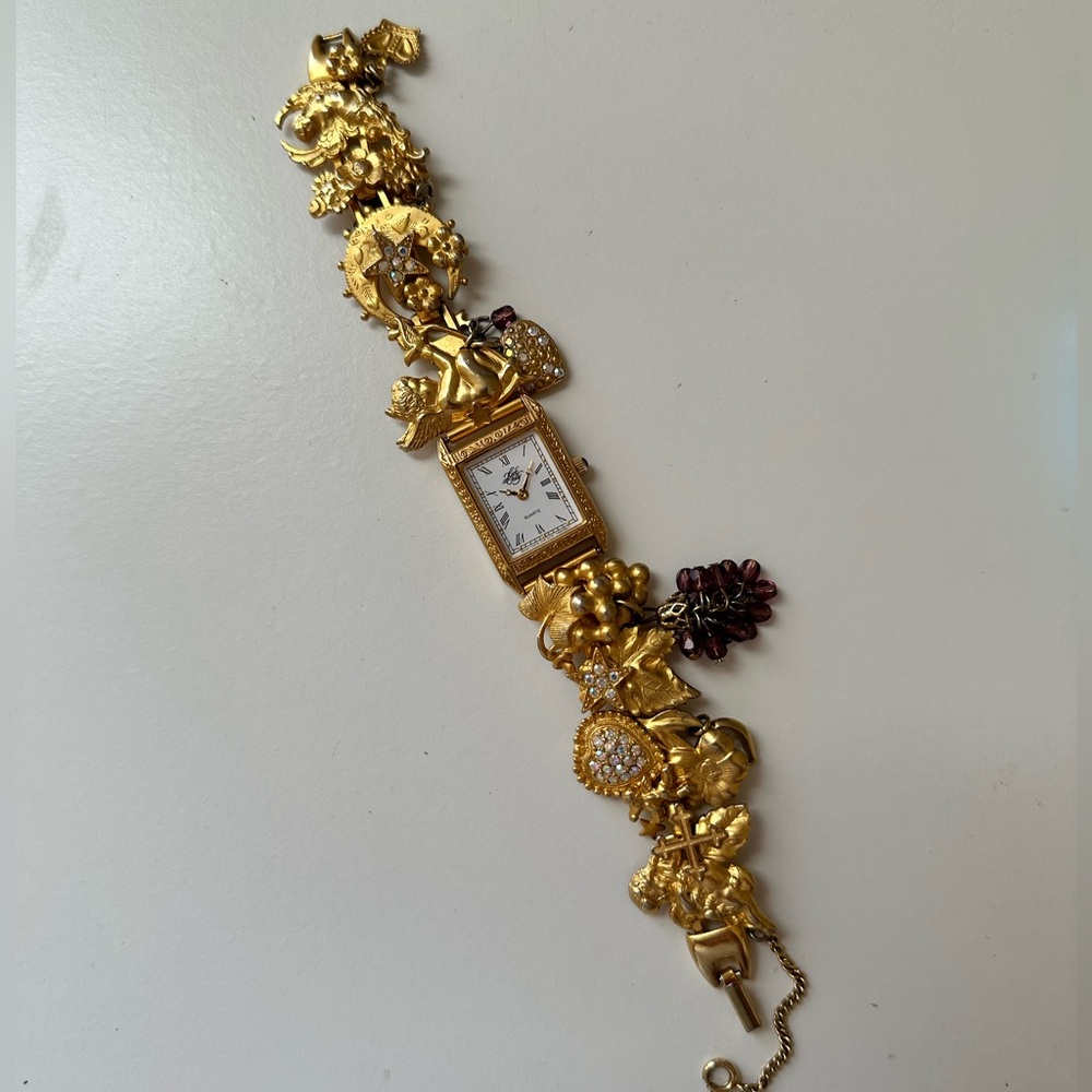 Kirks Folly Gold Toned Angel, Hearts, and Grapes Watch